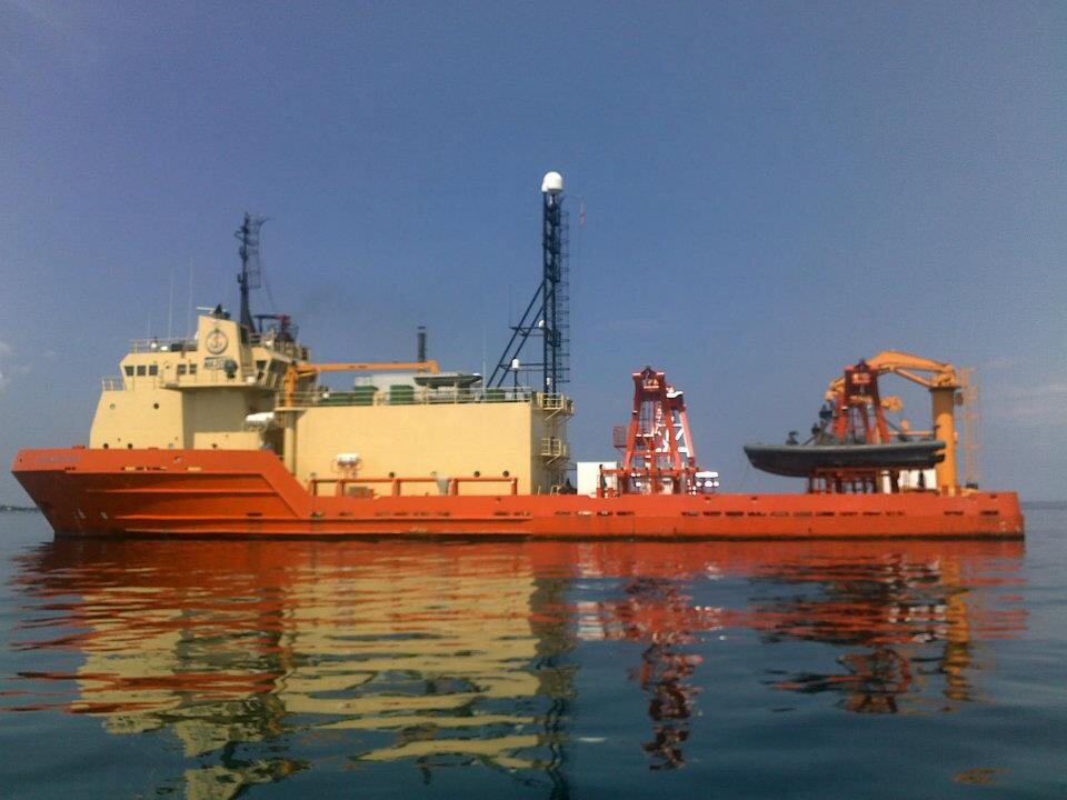 The orange special-operations support vessel MSV at anchor